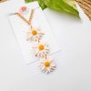 3 layered daisy pendant by mindful vibing